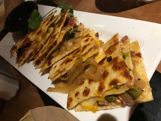 Iron Cactus Mexican Restaurant and Margarita Bar signature dishes Brisket QuesadillaTequila-Marinated Chicken BreastSouthwest PaellaChicken Enchiladas